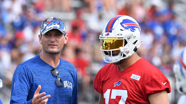 Jul 27, 2022; Pittsford, NY, USA; Buffalo Bills offensive coordinator Ken Dorsey talks with quarterback Josh Allen (17) during training camp at St. John Fisher University. Mandatory Credit: Mark Konezny-USA TODAY Sports
